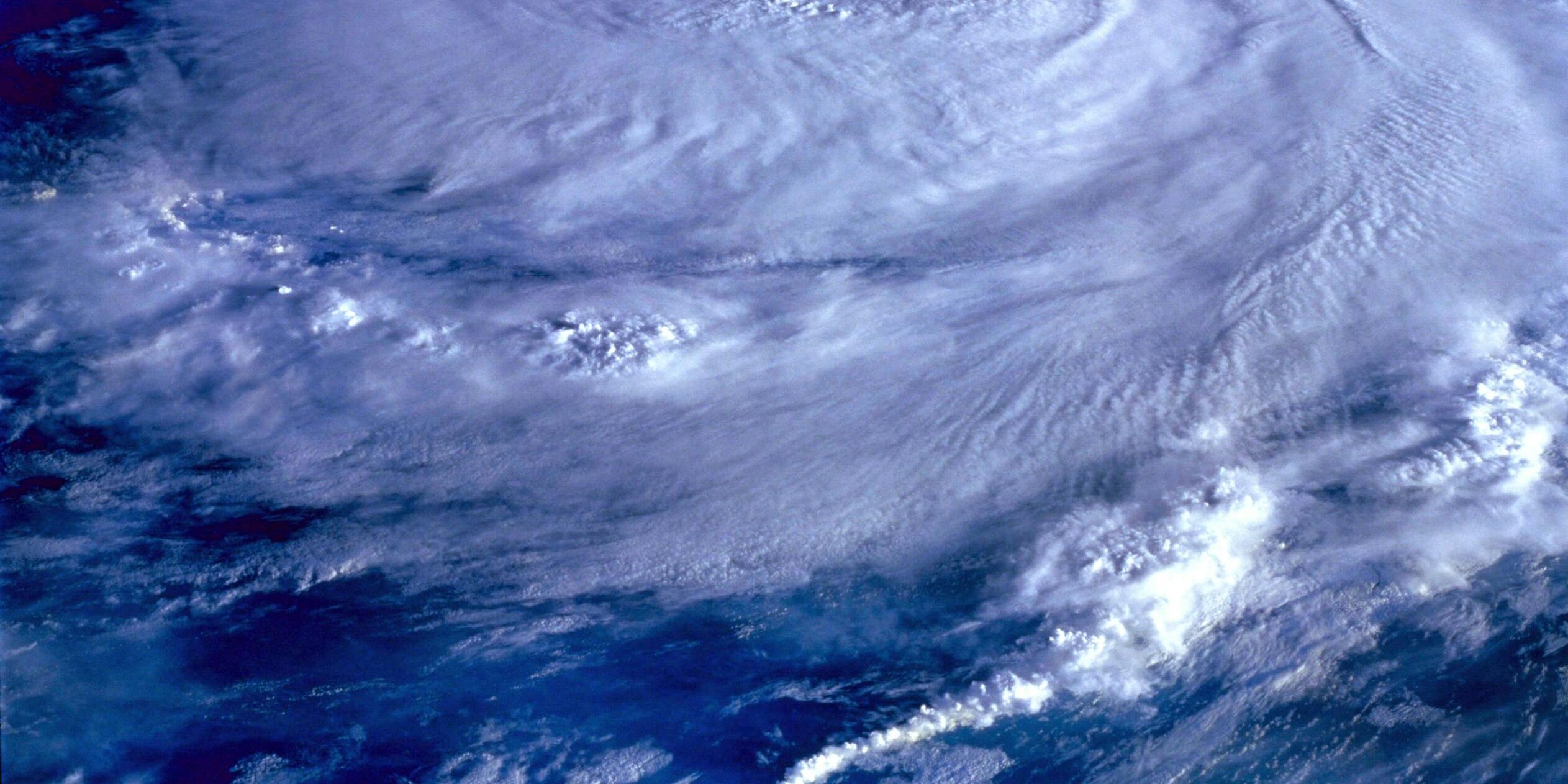 A breathtaking satellite image capturing a swirling hurricane over the Earth's ocean.